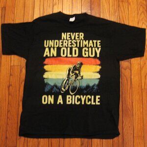 Never underestimate an old guy on a bicycle T-Shirt
